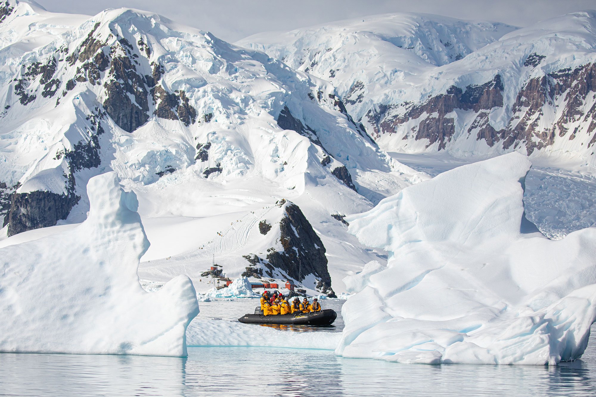 Quark Expeditions guests enjoy a Zodiac cruise in the waters of the Antarctic.